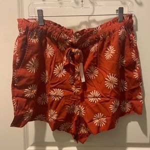 Rust-colored, daisy print, silky shorts